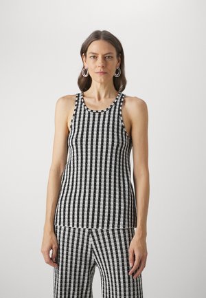 Musta-valkoinen raidallinen hihaton paita, jossa on pyöreä pääntie, slim fit -malli ja ribattu rakenne. Yhdistetty koordinoivien raidallisten housujen kanssa.