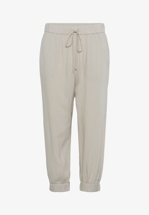 Beige vetokäyttöiset housut, joissa on elastinen vyötärö, nyörisolmuke ja kootut hihansuut. Valmistettu kevyestä kankaasta, jolla on sileä tekstuuri.