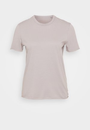 T-shirt beige clair à manches courtes en coton, avec un col rond et une coupe décontractée, au toucher lisse et sans motifs visibles.