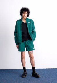Reebok Classic CROSS CHECK - Tréningruha alsók - collegiate green