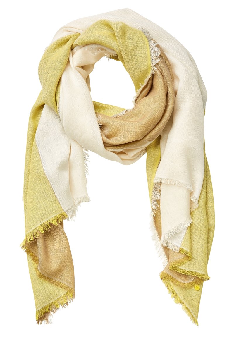 Écharpe légère en tissu doux dans des tons beige, marron clair et jaune pâle, disposée en plis lâches avec des bords à franges.