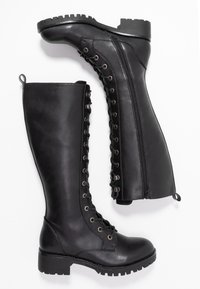 Black leather knee-high boots with a sleek design, featuring a lace-up front, side zipper, and rugged sole with a textured finish.