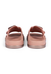 Pink rubber sandals with a wide strap and metallic buckle, featuring a flexible sole and a smooth, matte finish.