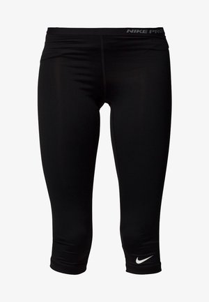Leggings de compression courts noirs Nike Pro avec taille élastique et logo Nike swoosh blanc près de l’ourlet.