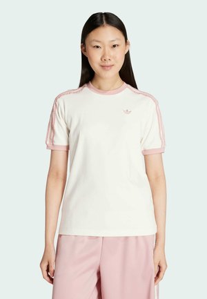 White cotton t-shirt with pink collar and sleeve accents, featuring striped pink trim on shoulders and a small logo on the chest.