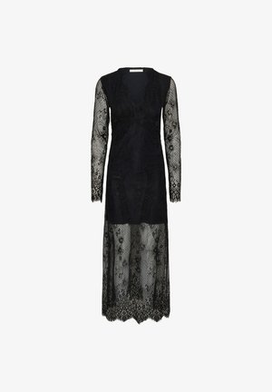 Mustassa pitsimekossa on pitkät hihat ja V-kaula-aukko. Se sisältää monimutkaisia kukkakuvioita ja hieman aallotetun helman. Läpinäkyvä materiaali kauttaaltaan.