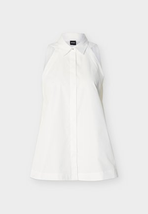 Αμάνικο λευκό πουκάμισο με γιακά, κρυφά κουμπιά στο μπροστινό μέρος, εφαρμοστή γραμμή και ετικέτα με την επωνυμία μέσα στον γιακά.