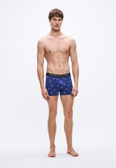 Navy blue boxer briefs with white polo horse print, elastic waistband featuring "POLO RALPH LAUREN," and a fitted design.