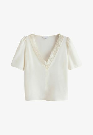Short-sleeve white blouse with a V-neckline. Features lace trim around the neck and a slightly fitted silhouette. Smooth, lightweight fabric.