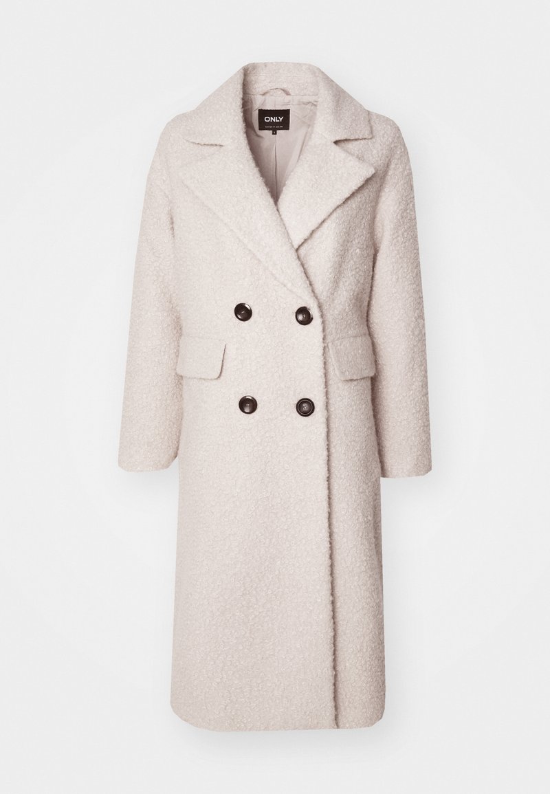 Helle beiges, doppelt geknöpftes Sakko aus strukturiertem Stoff mit Reverskragen, zwei Fronttaschen und schwarzen Knöpfen.