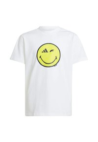 White cotton t-shirt featuring a large yellow smiley face graphic with black outlines and an Adidas logo on the smile.