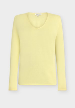 Light yellow long-sleeve knit sweater with V-neck and small Tom Tailor brand label at the collar.