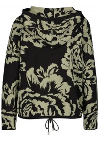 Sudadera con capucha de base negra, con grandes patrones florales verdes, dobladillo ajustable con cordón y mangas largas.