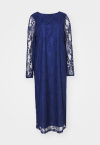Vestido de renda azul-marinho com mangas longas, apresentando um decote redondo e padrões florais intrincados. Silhueta fluida com um acabamento delicado.