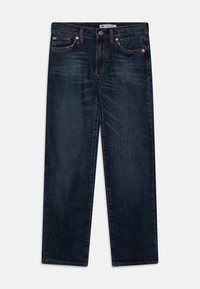 Tmavě modré džíny z denimu se rovnou nohavicí, které mají měděné nýty, zapínání na knoflíky a design s pěti kapsami. Hladká textura.