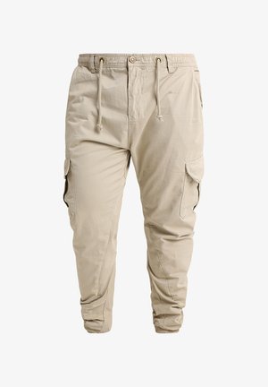 Beežid cargo-püksid elastse vöökohaga, nööriga, eesnupu, küljetaskute klappide ja elastsete paeltega pahkluudes.