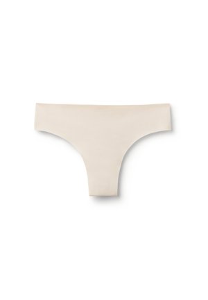 Tanga beige sin costuras con textura suave y cintura ancha, mostrado sobre un fondo blanco.