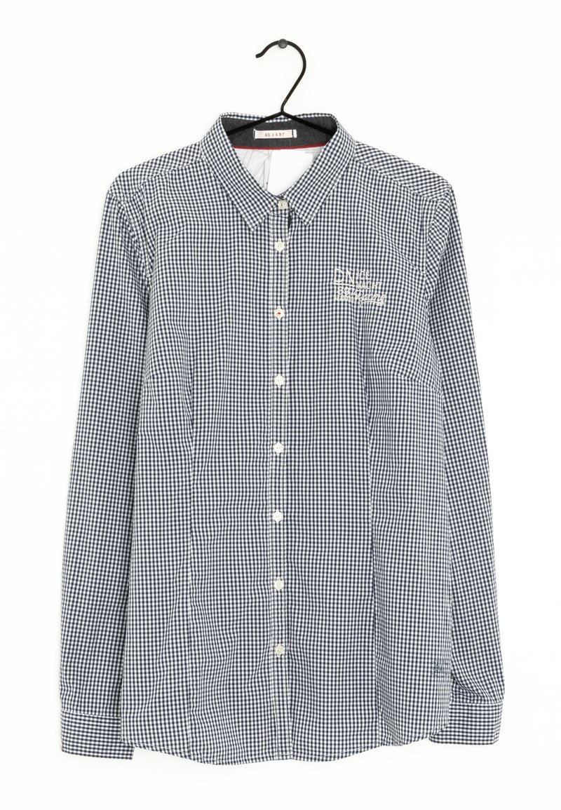 Svartvit rutigt mönstrad skjorta med lång ärm, knäppning framtill, vita knappar och nedvikt krage. Har broderad logotyp.