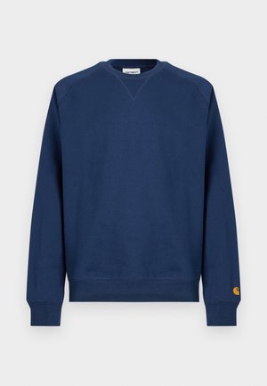 Felpa blu navy con scollo tondo, polsini e orlo a coste. Presenta una piccola toppa del logo sulla manica sinistra. Realizzata in tessuto morbido.