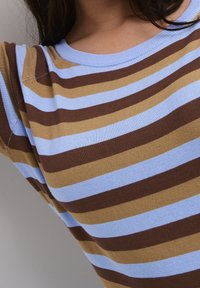 Brown and light blue striped knit top with a round neckline and short sleeves, featuring ribbed texture and smooth finish.