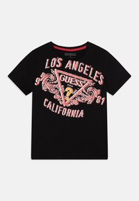 Svart bomull T-skjorte med grafisk trykk i rødt og hvitt, med "LOS ANGELES" og "CALIFORNIA," samt en trekantet "GUESS" logo.