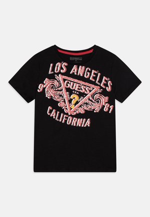 Tricou din bumbac negru cu un imprimeu grafic în roșu și alb, având inscripțiile "LOS ANGELES" și "CALIFORNIA" și un logo triunghiular "GUESS".