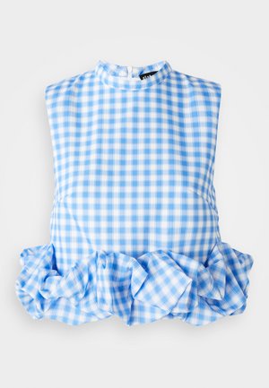 Modra in bela gingham vzorčasta brezrokavna majica z naborkom na robu in visokim ovratnikom. Tkanina je lahka in gladka. Zapiranje na zadrgo na hrbtni strani.