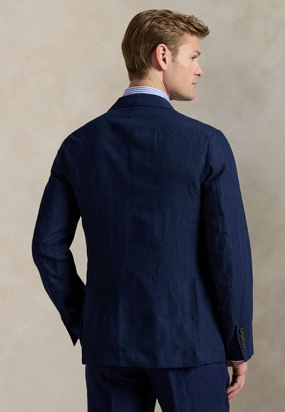 Navy blue linen blazer featuring a tailored fit, notched lapels, and button accents on the sleeves, shown from the back.