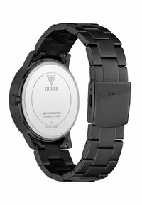 Ceas Guess din oțel inoxidabil negru, cu un design elegant, având un capac strălucitor pe care sunt afișate detalii ale brandului și caracteristici de rezistență la apă.