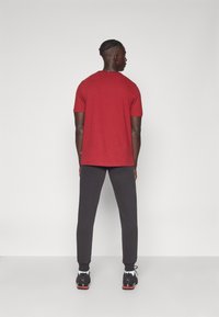 Puma SWEATPANTS  - Donji dijelovi trenirke - puma black