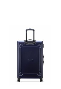 Valigia rigida blu navy con finitura testurizzata, manico retraibile e quattro ruote. Presenta angoli protettivi e una zipper laterale.