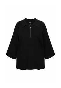 Top nero con scollo zip, colletto strutturato e maniche larghe. Realizzato in un tessuto morbido e texturizzato, presenta una vestibilità rilassata.
