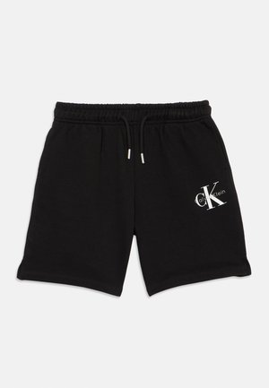Schwarze Freizeitshort mit elastischem Bund und Kordelzug, mit weißem "cK Calvin Klein"-Logo am rechten Bein.