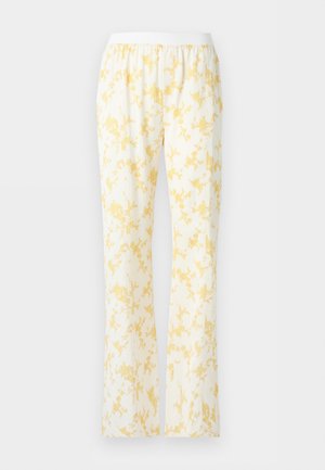 Pantaloni albi cu croială lejeră și talie elastică, cu un model floral galben deschis pe întreaga suprafață.