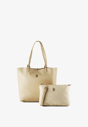 Beige katoenen draagtas met dubbele handvatten en bijpassende kleine crossbodytas met verstelbare riem en subtiel patroon.