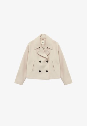 Korte crèmekleurige dubbelbreasted jas van een wolmix, met grote revers, twee voorzakken en zwarte knoopaccenten.