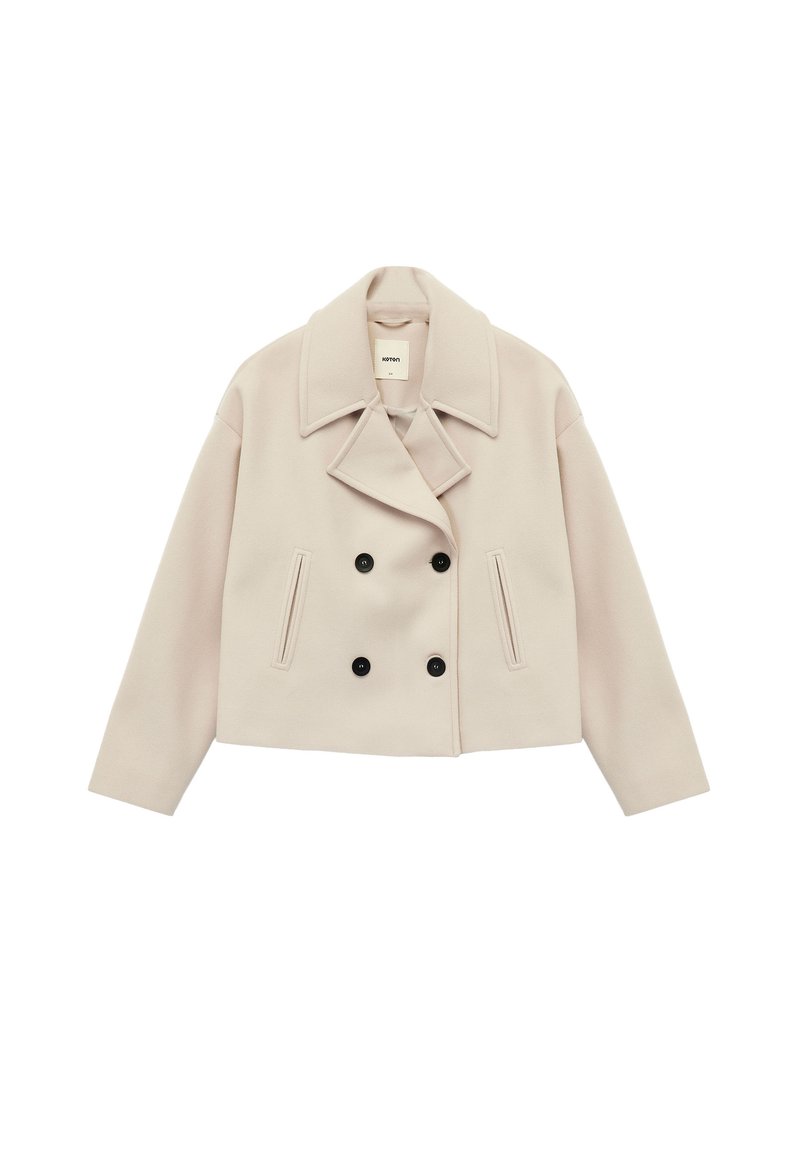 Afkortet cremet dobbeltbrystet frakke i uldblanding, med store klapper, to forlommer og sorte knapdetaljer.