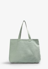 Borsa tote verde chiaro realizzata in tessuto, con due manici, una texture morbida e un design semplice senza decorazioni.