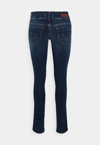 Dark blue denim jeans with a skinny fit. Features include a five-pocket design, subtle fading, and contrasting stitching.