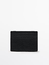 Black leather cardholder with a textured surface, featuring multiple slot openings for cards and a slim rectangular design.
