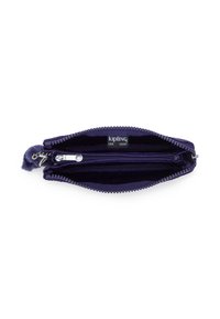 Purple zippered pouch with two compartments, one with a silver zipper pull and a small furry keychain attached inside.