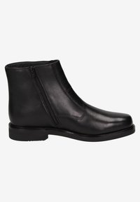 Bottines en cuir noir avec une texture lisse, fermeture zippée sur le côté, bout rond et détails de couture subtils. Petit talon empilé.