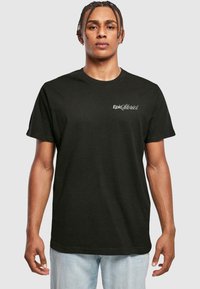 Black cotton t-shirt with short sleeves, featuring white "Epic Stories" text on the left chest area, round neck, and relaxed fit.