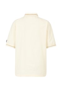 Polo a maniche corte di colore crema chiaro in tessuto texturizzato, con colletto a righe in contrasto e logo discreto sulla manica sinistra.
