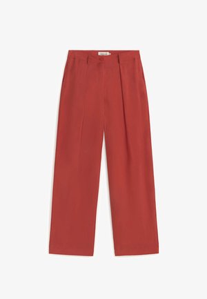 Široke hlače širokih nogavica boje hrđe s visokim strukom, prednjim naborima, petljama za remen, bočnim džepovima te zatvaranjem na gumb i patentni zatvarač.