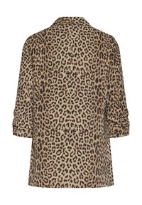 Μπλούζα λεοπάρ από ελαφρύ ύφασμα, με γιακά και γυρισμένα μανίκια. Κύρια χρώματα είναι οι αποχρώσεις του μπεζ και του καφέ με χαρακτηριστικές κηλίδες.