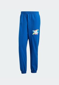 Blaue Hosen mit elastischem Bund und einem bunten, abstrakten Motiv vorne oben links. Gebündelte Säume sorgen für eine schmal zulaufende Passform.