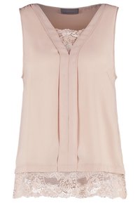 Blouse rose pâle sans manches avec col en V, pli vertical sur le devant, bordure en dentelle à l'ourlet et insert en dentelle à l'encolure.