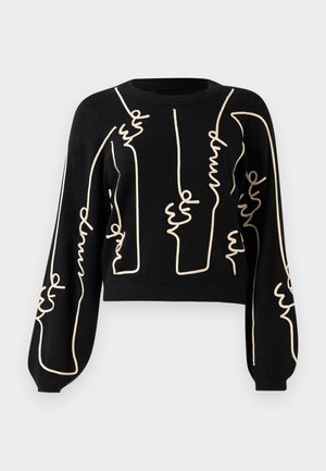Maglione cropped nero con maniche lunghe a sbuffo e un design astratto in linea beige chiaro su parte anteriore e maniche. Tessuto morbido.