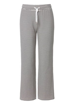 Pantalones de lounge a rayas blancas y negras con un corte relajado, cinturilla elástica y cordón, confeccionados en una tela suave y ligera.